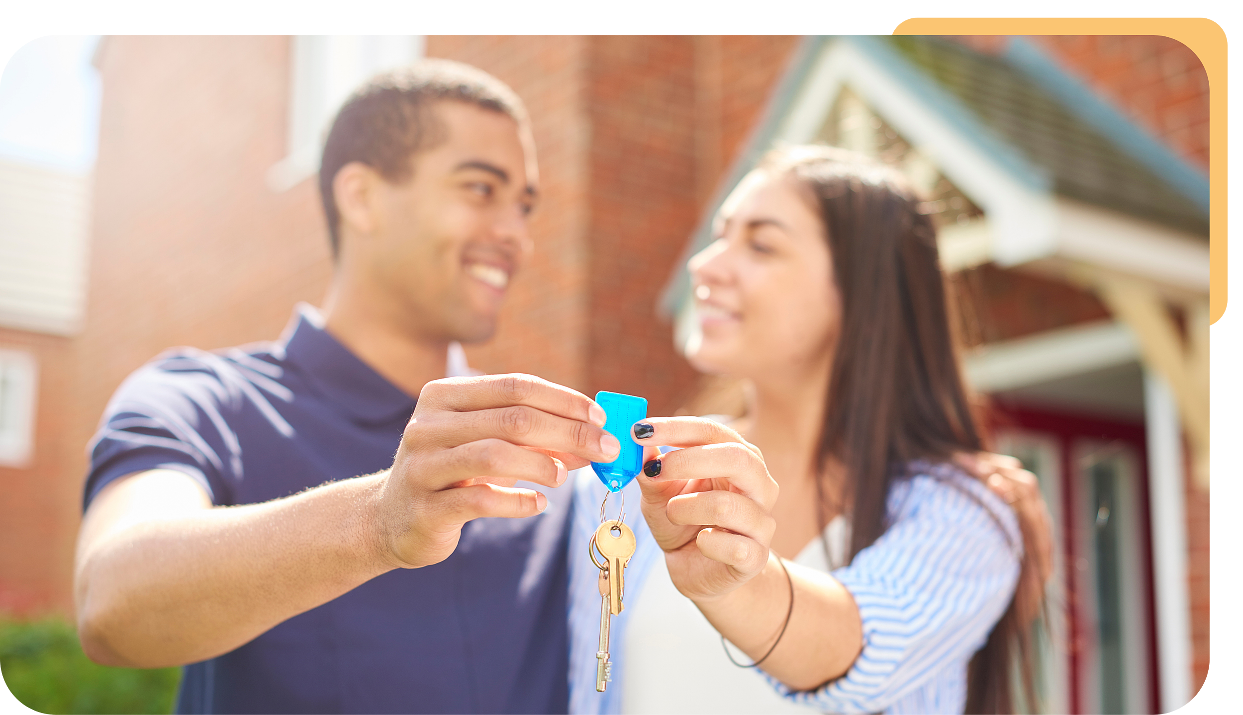 Man and Woman holding house keys